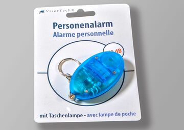 Ansicht auf den eingepackten Schlüsselanhänger. Er ist hellblau.