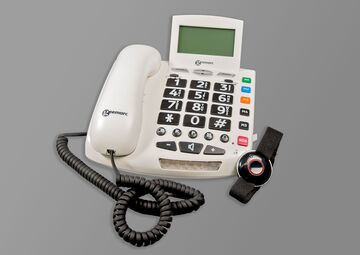 Ansicht auf ein weißen Telefon mit Hörer und Nummernblock.